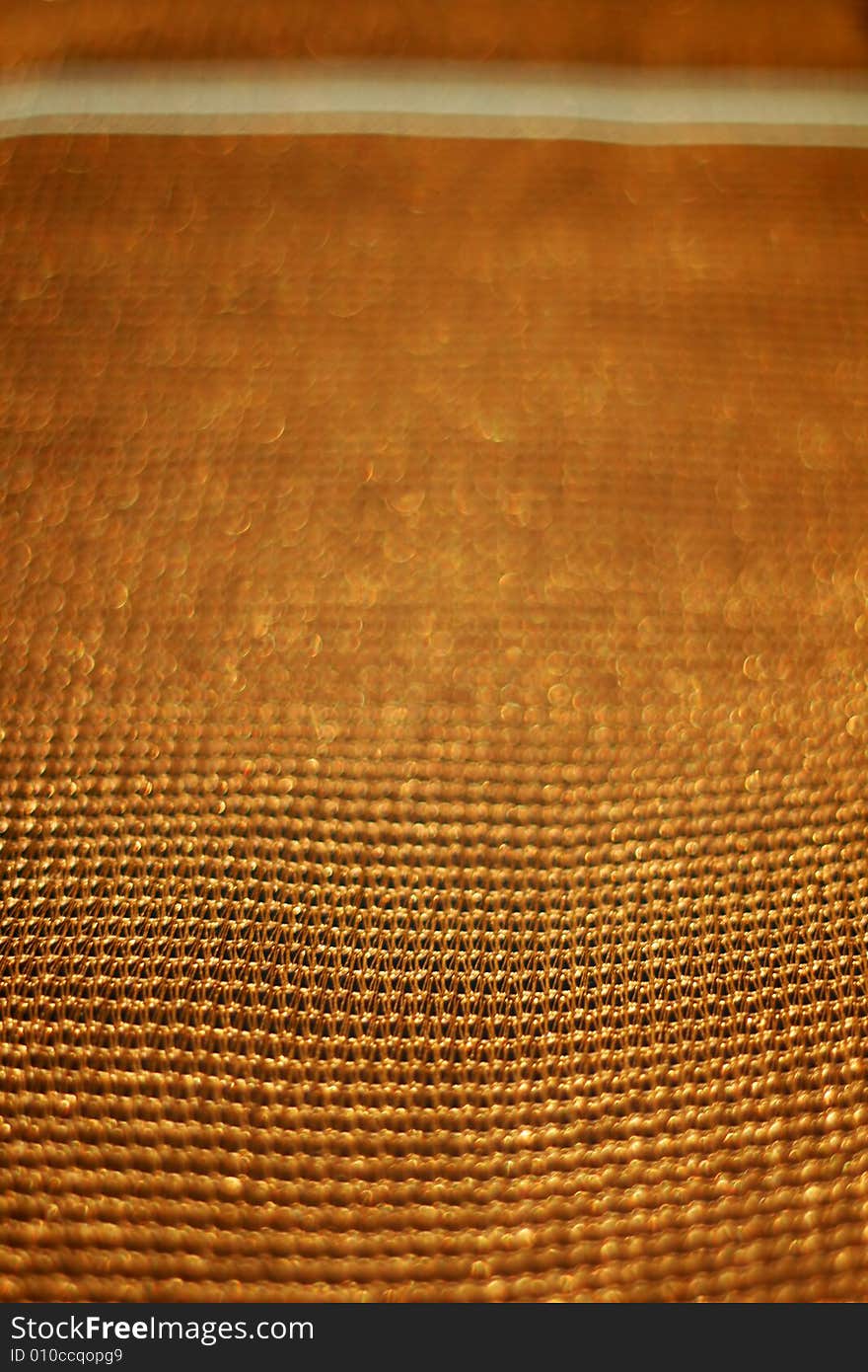 Golden background of net with shallow depth of field