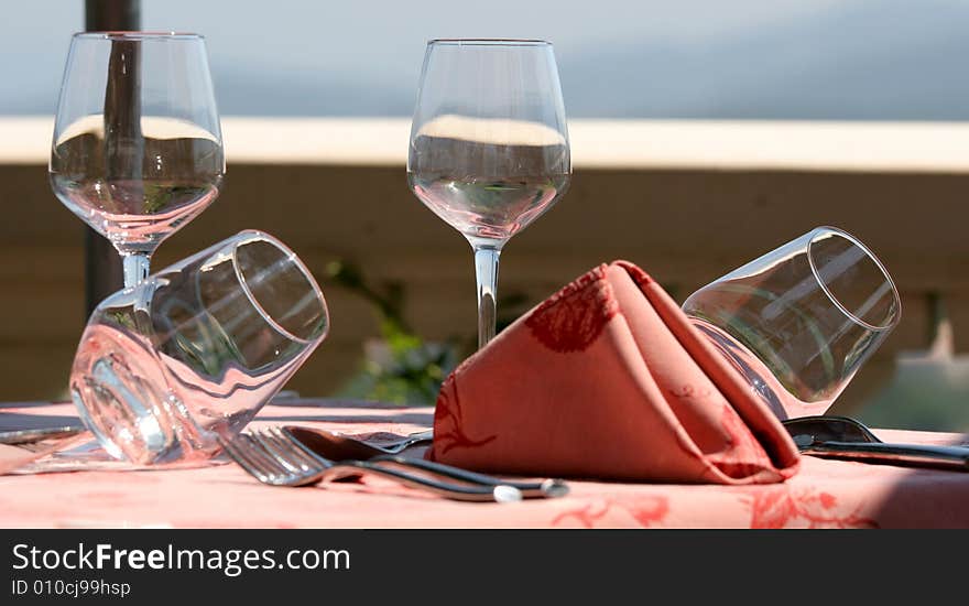 Restaurant table on sunny terrace.