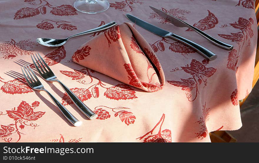 Restaurant table on sunny terrace.