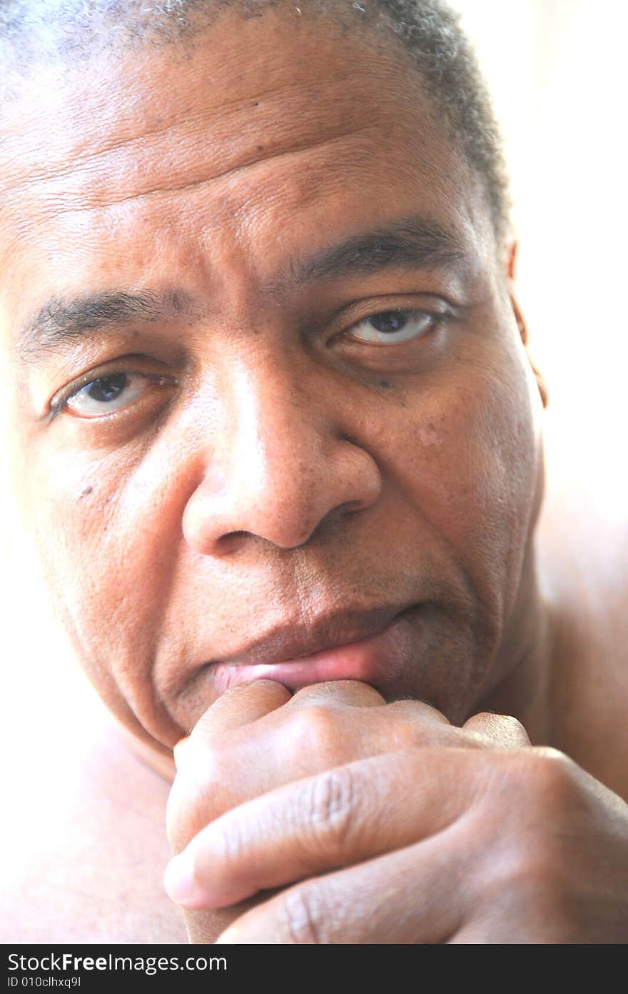 Portrait of an african american man relaxing at home. Portrait of an african american man relaxing at home.