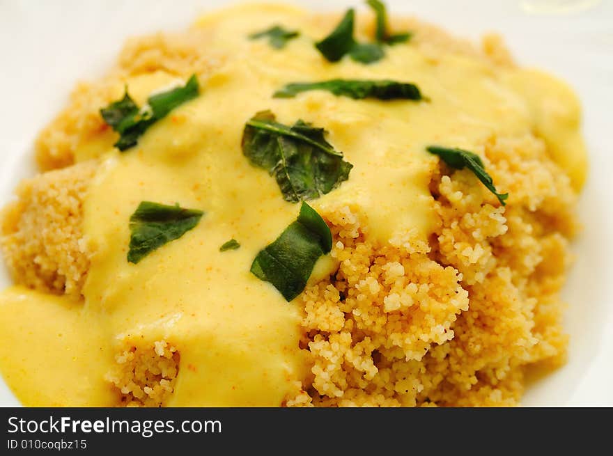 Cous Cous with curry sauce and Basil