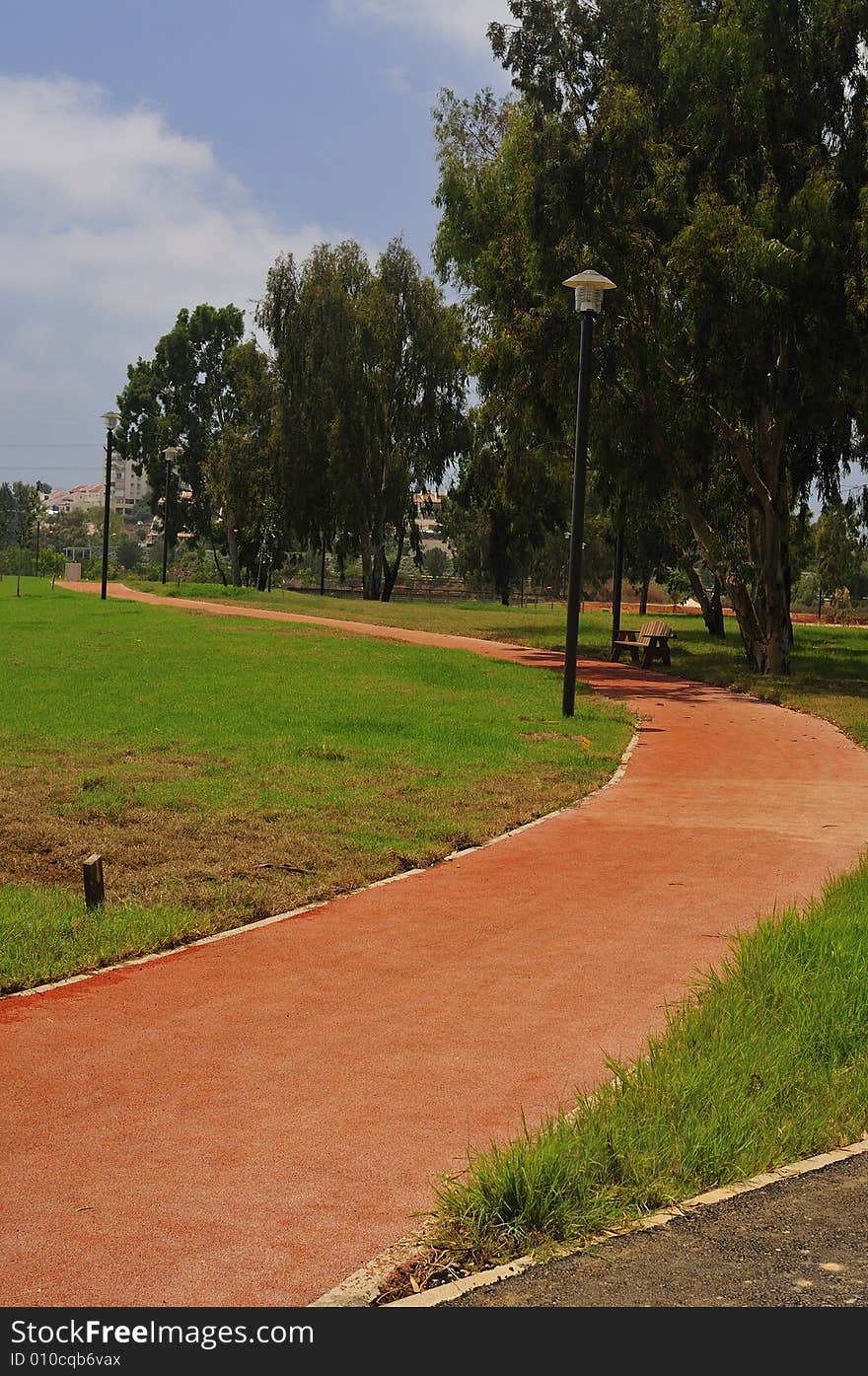 Track with rubber-band covering for walking and harness racing. Track with rubber-band covering for walking and harness racing