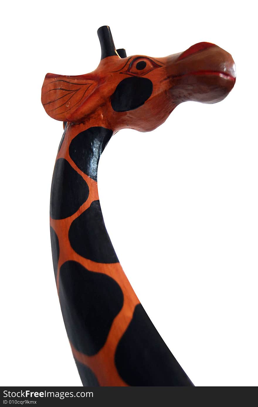 Giraffe, carved in wood, isolated on white