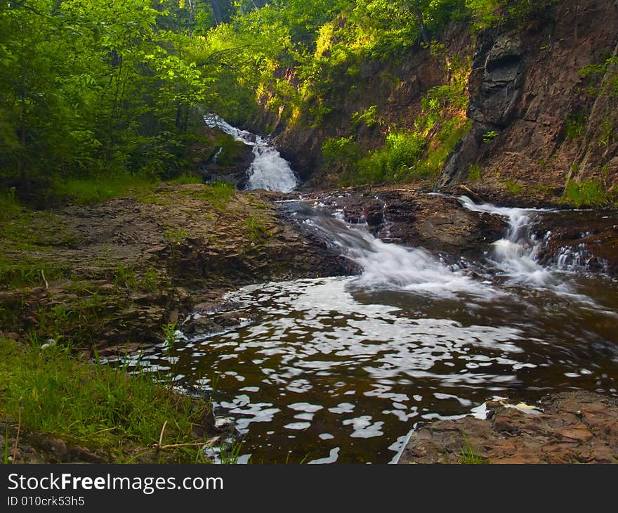 Falls, Water, And Stone On A Summer Evening