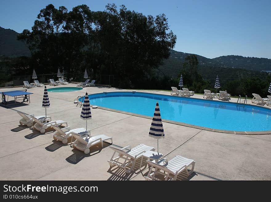 Poolside on the sea at le lavandou azur hotel  french riviera, france, two pools. Poolside on the sea at le lavandou azur hotel  french riviera, france, two pools