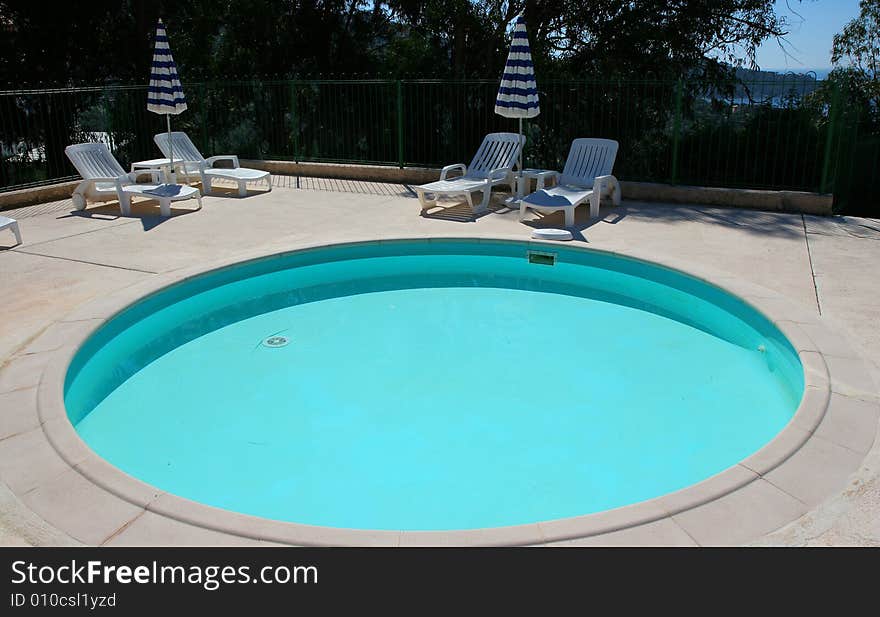 Poolside on the sea at le lavandou azur hotel  french riviera, france, little pool. Poolside on the sea at le lavandou azur hotel  french riviera, france, little pool