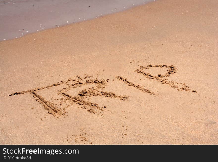 The word TRIP written in sand