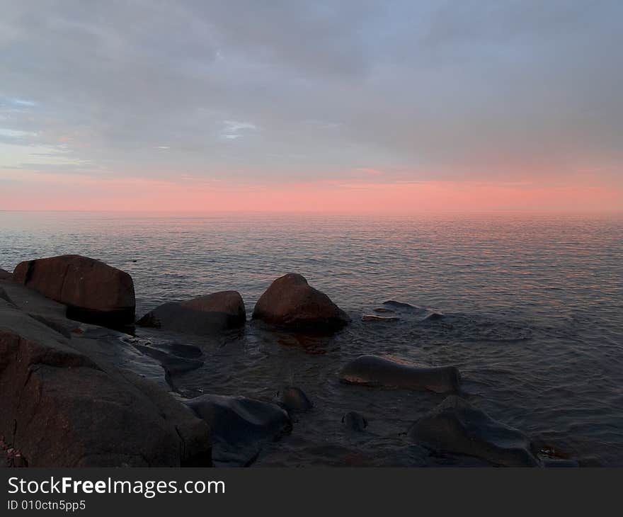 Infinite pastel peach sunset on Lake Superior. Infinite pastel peach sunset on Lake Superior