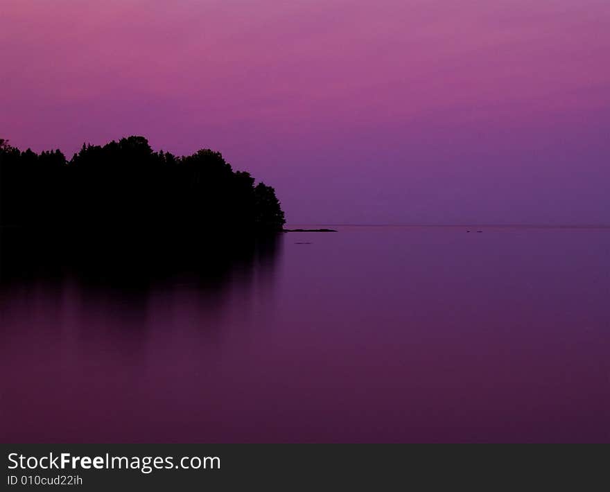 Flood Bay on the North Shore of Lake Superior in a magenta sunset. Flood Bay on the North Shore of Lake Superior in a magenta sunset