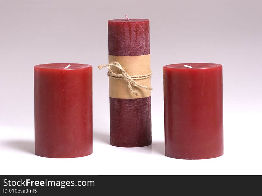 Three Red Candles on a white background