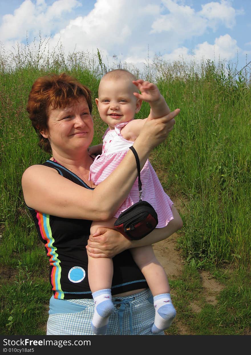 Little girl with grandmother at summer day. Little girl with grandmother at summer day