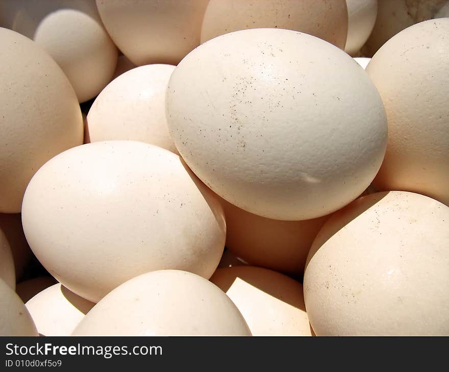 Several hen eggs in a basket