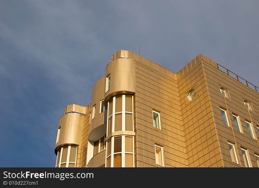 Modern office building over blue sky with clouds. Modern office building over blue sky with clouds