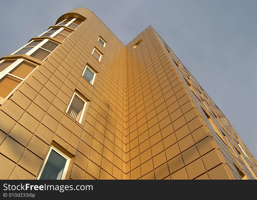 Modern office building over blue sky with clouds. Modern office building over blue sky with clouds