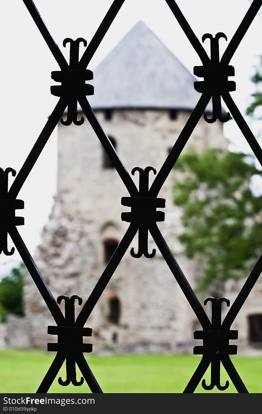 Iron Decorative lattice through wich one could see a castle