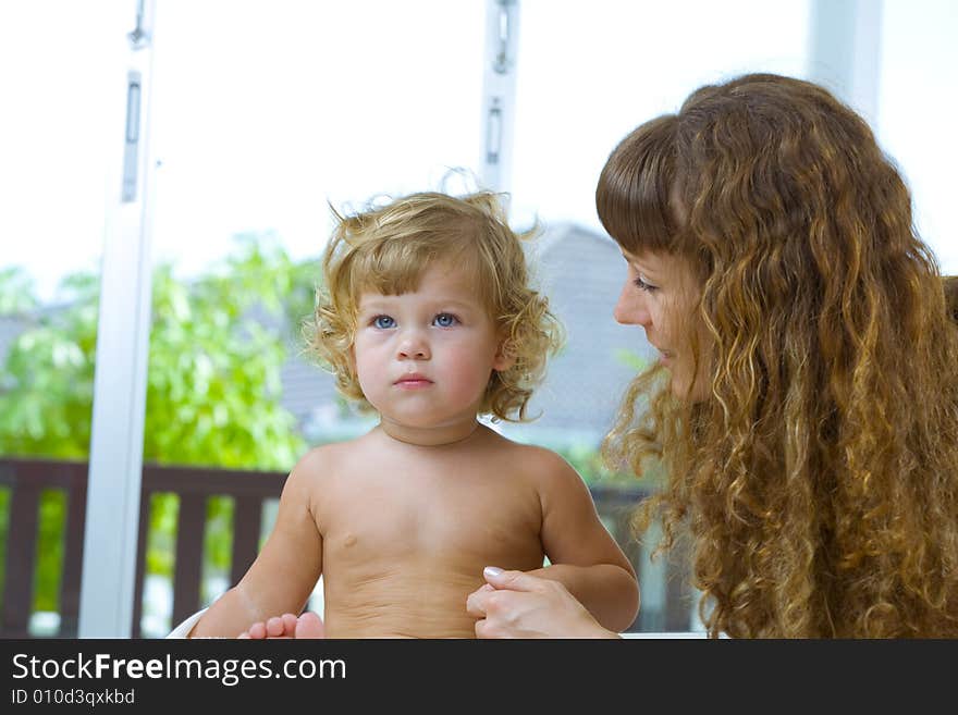 High key portrait of happy mother with baby. High key portrait of happy mother with baby