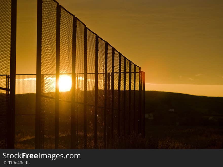 Sunset through the grating evening