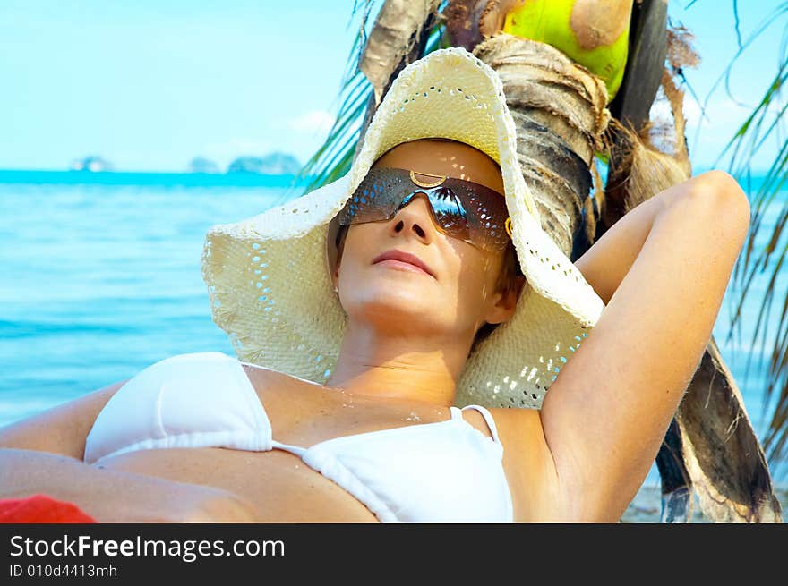 View of nice woman having fun on tropical beach. View of nice woman having fun on tropical beach