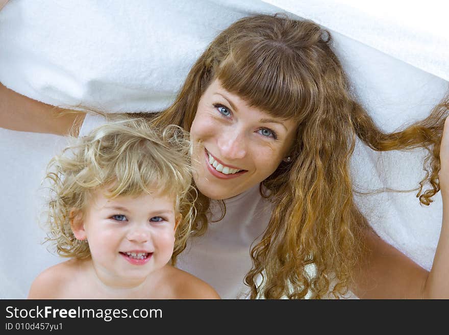 High key portrait of happy mother with baby. High key portrait of happy mother with baby