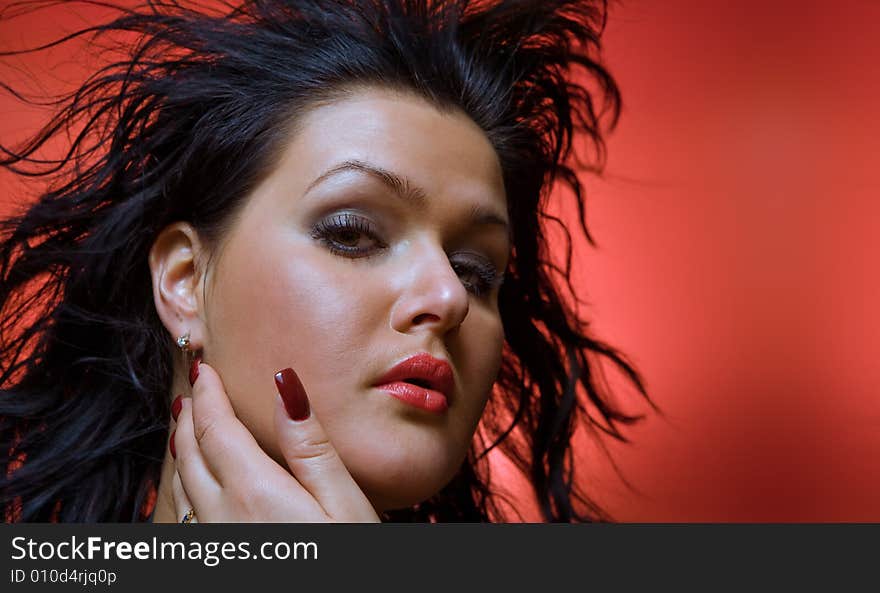 Portrait of  nice young brunette on red back. Portrait of  nice young brunette on red back