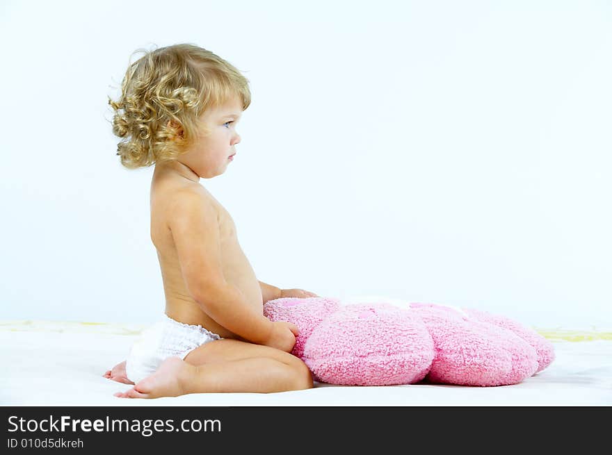 High key portrait of young baby on white back