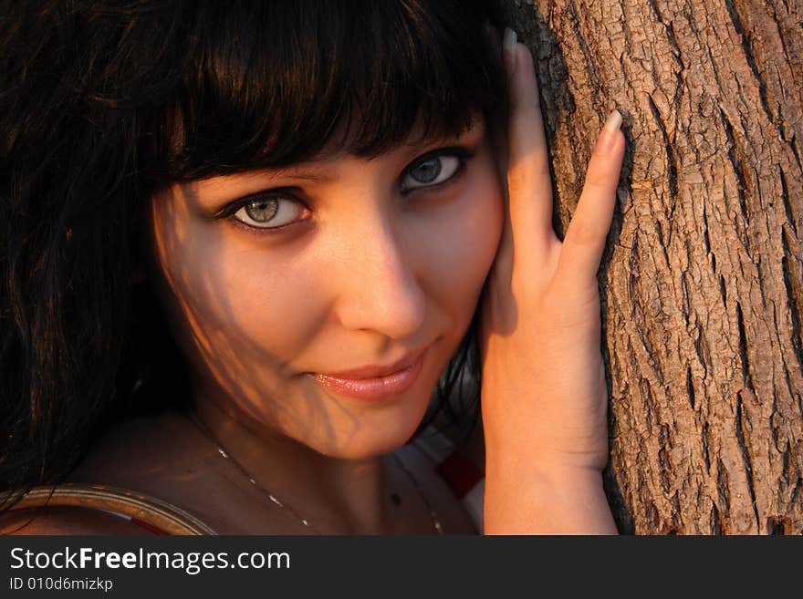 Beautiful woman's portrait in sunset light.