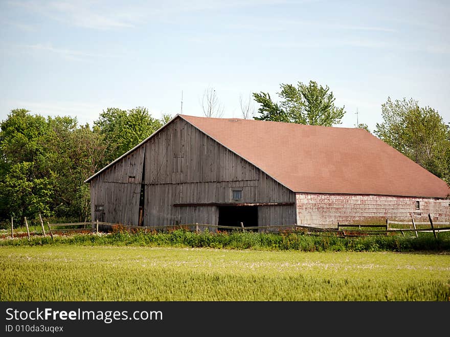 Old weathered barn in the morning light. Old weathered barn in the morning light.