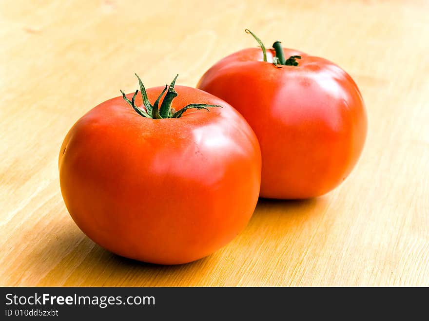 Two tomatoes  .a close up shot