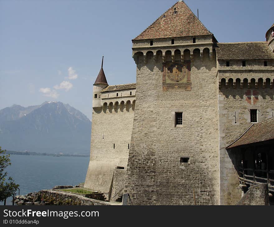 The castle of Chillon juts out into the waters of Lake Geneva at Montreau, Switzerland.  The picture shows about half of the eastern side.  Lord Byron visited this castle and left his name carved into the rock on a pillar in the dungeon. The castle of Chillon juts out into the waters of Lake Geneva at Montreau, Switzerland.  The picture shows about half of the eastern side.  Lord Byron visited this castle and left his name carved into the rock on a pillar in the dungeon.