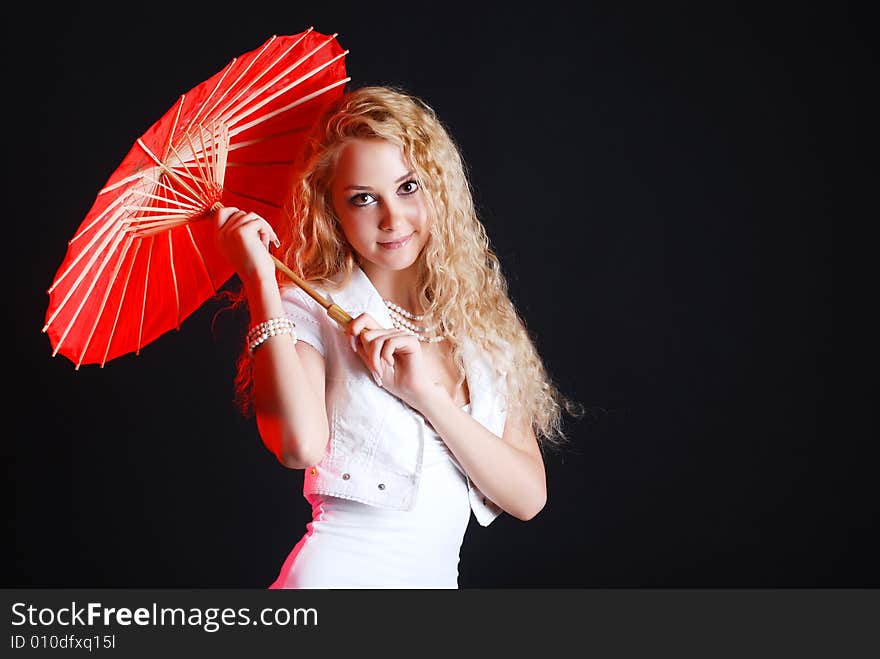 Portrait of young beauty woman in white dress at black background with umbrella. Portrait of young beauty woman in white dress at black background with umbrella