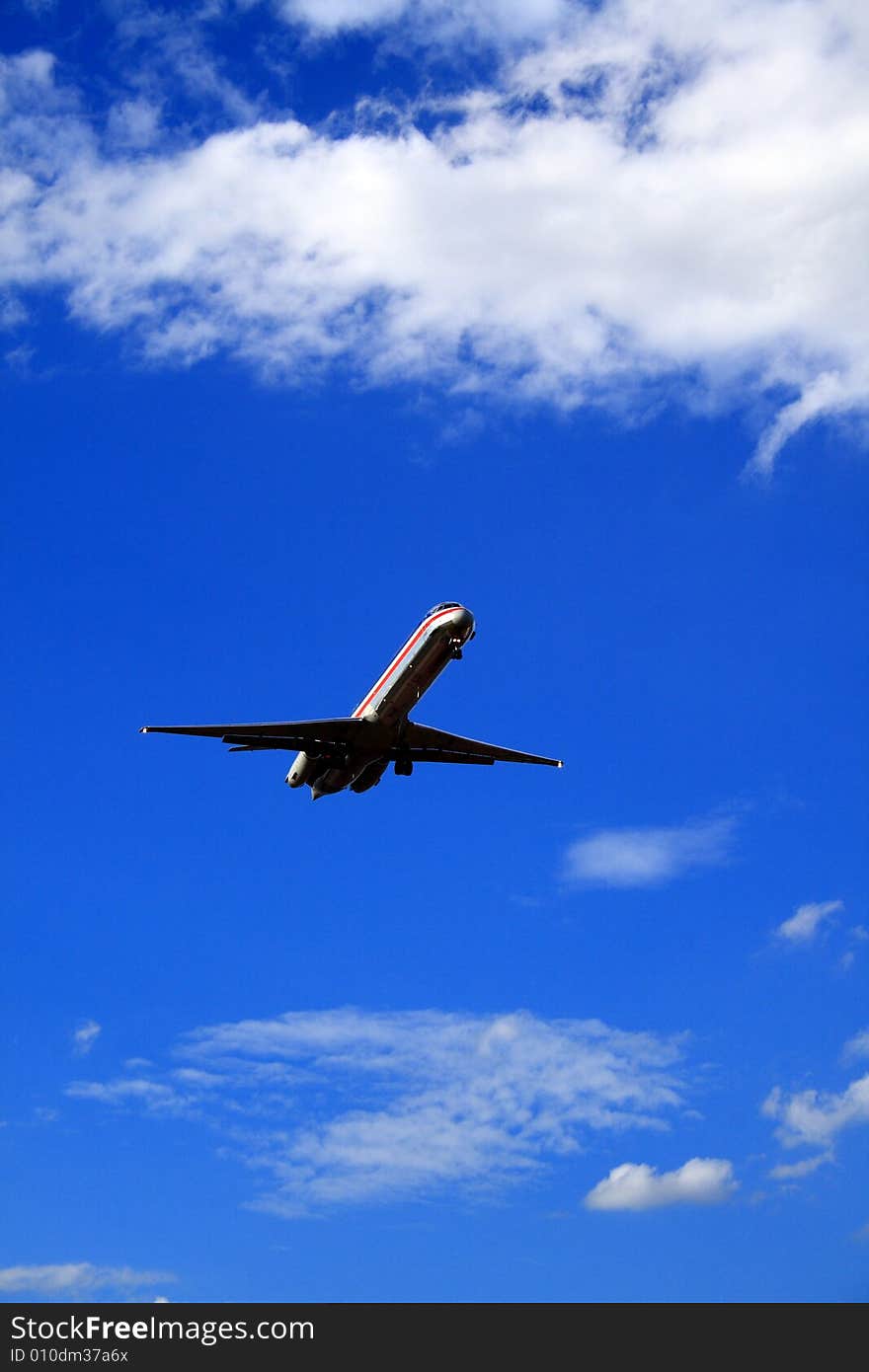 Jet airplane set against a vivid blue sky. Jet airplane set against a vivid blue sky