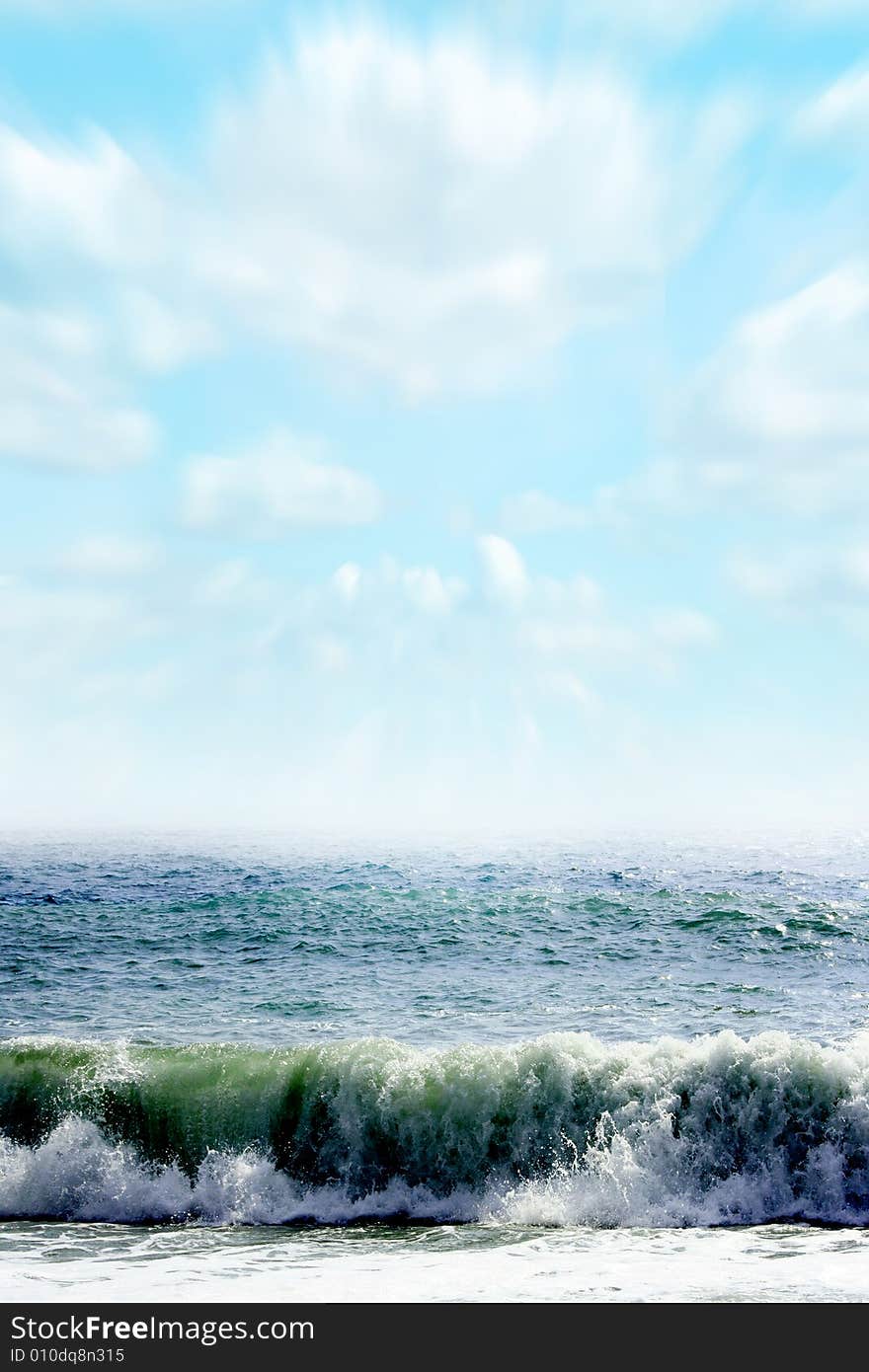 Wave on sea beach under year blue sky and cloud