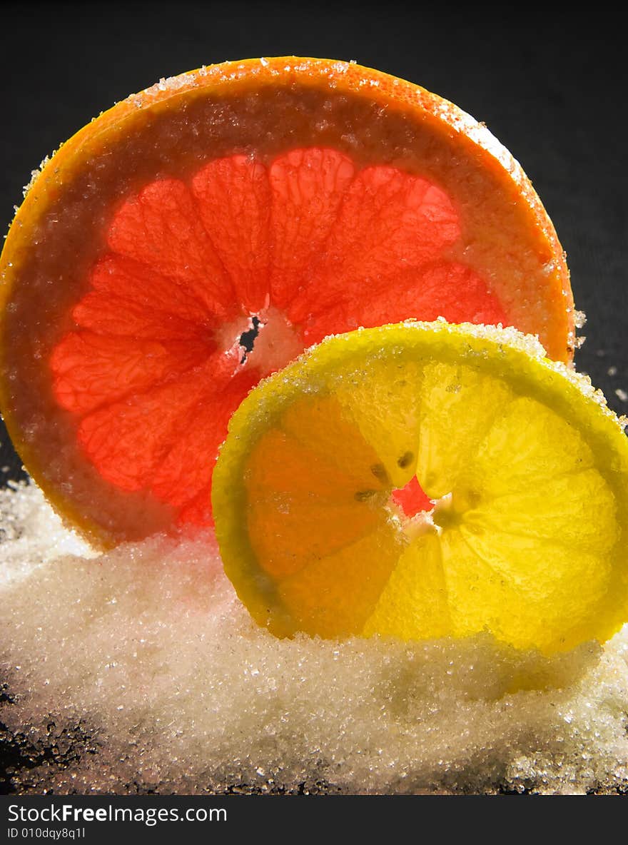 Lemon and the grapefruit strewed by sugar. Lemon and the grapefruit strewed by sugar