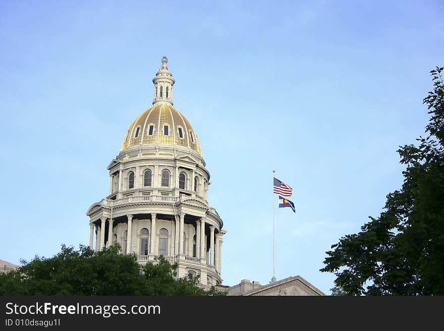 American and Colorado flags on Capitol State building, Denver, Colorado, USA