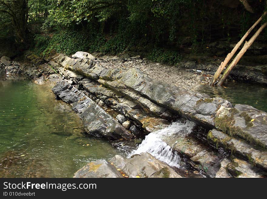 Mountain river with waterfalls