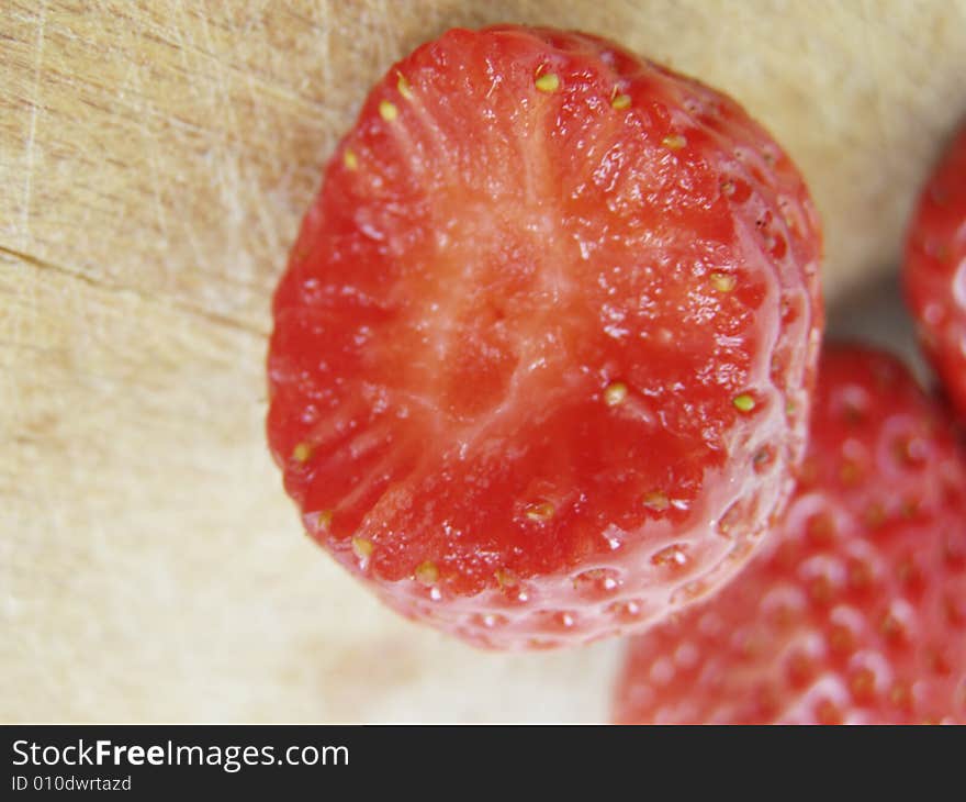 Three shiny strawberries isolated on kitchen wooden board, the front one bitten

*RAW format available. Three shiny strawberries isolated on kitchen wooden board, the front one bitten

*RAW format available