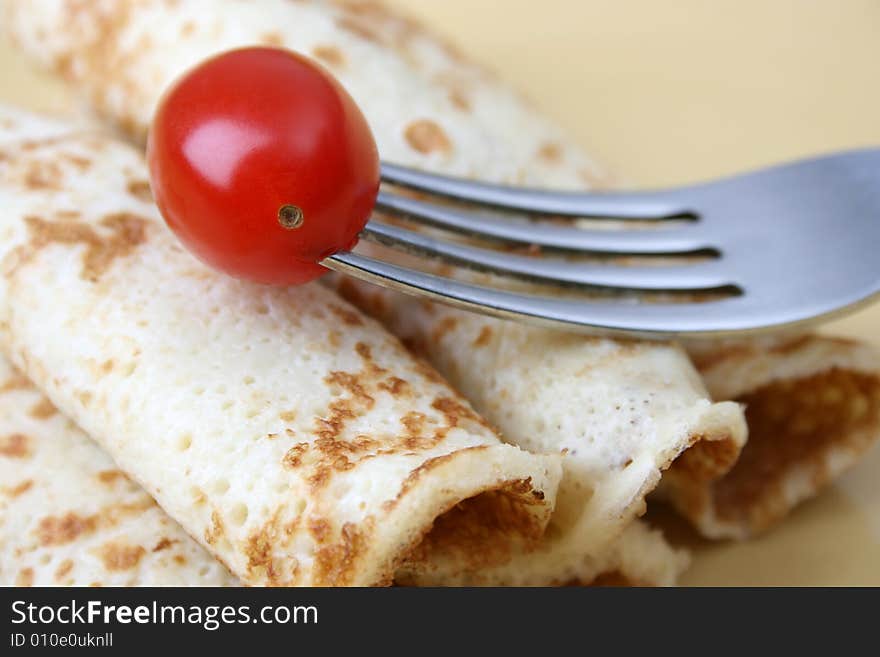 Close up of pancakes on a yellow plate