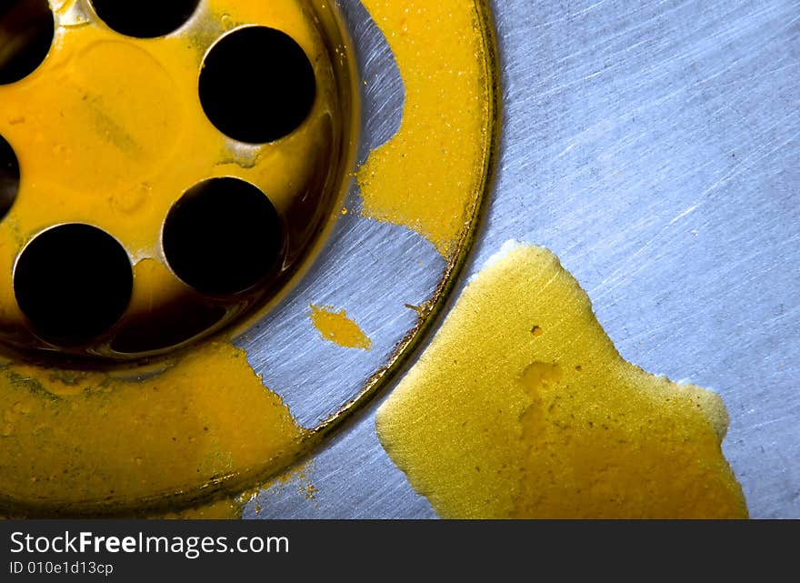 Macro of sink with yellow liquid substance