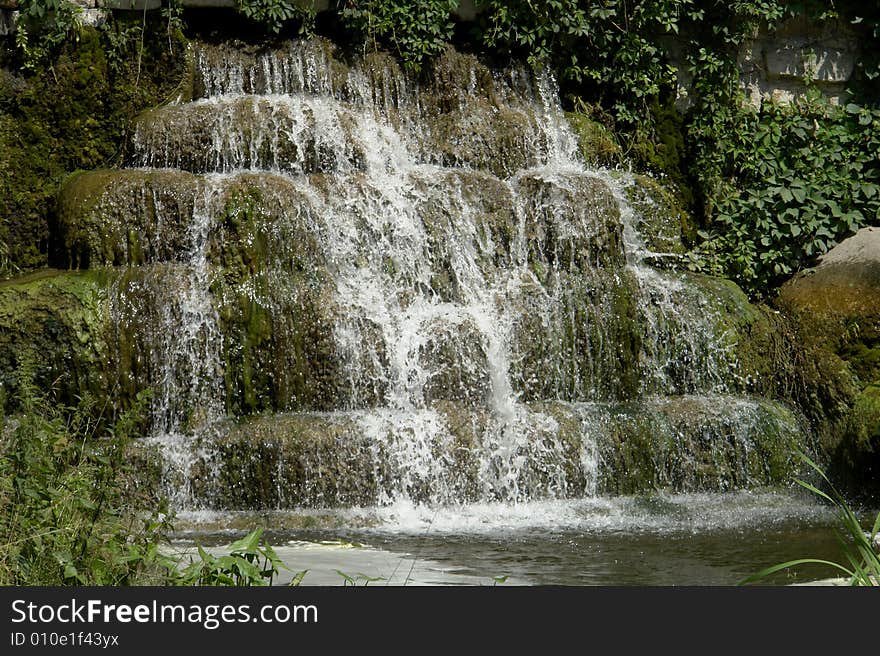 Water on a background of rocks. Water on a background of rocks