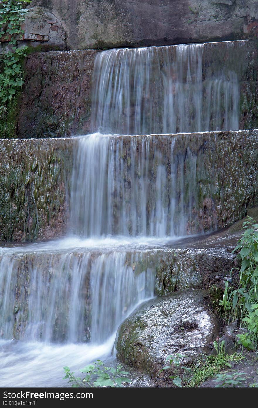 Water on a background of rocks. Water on a background of rocks