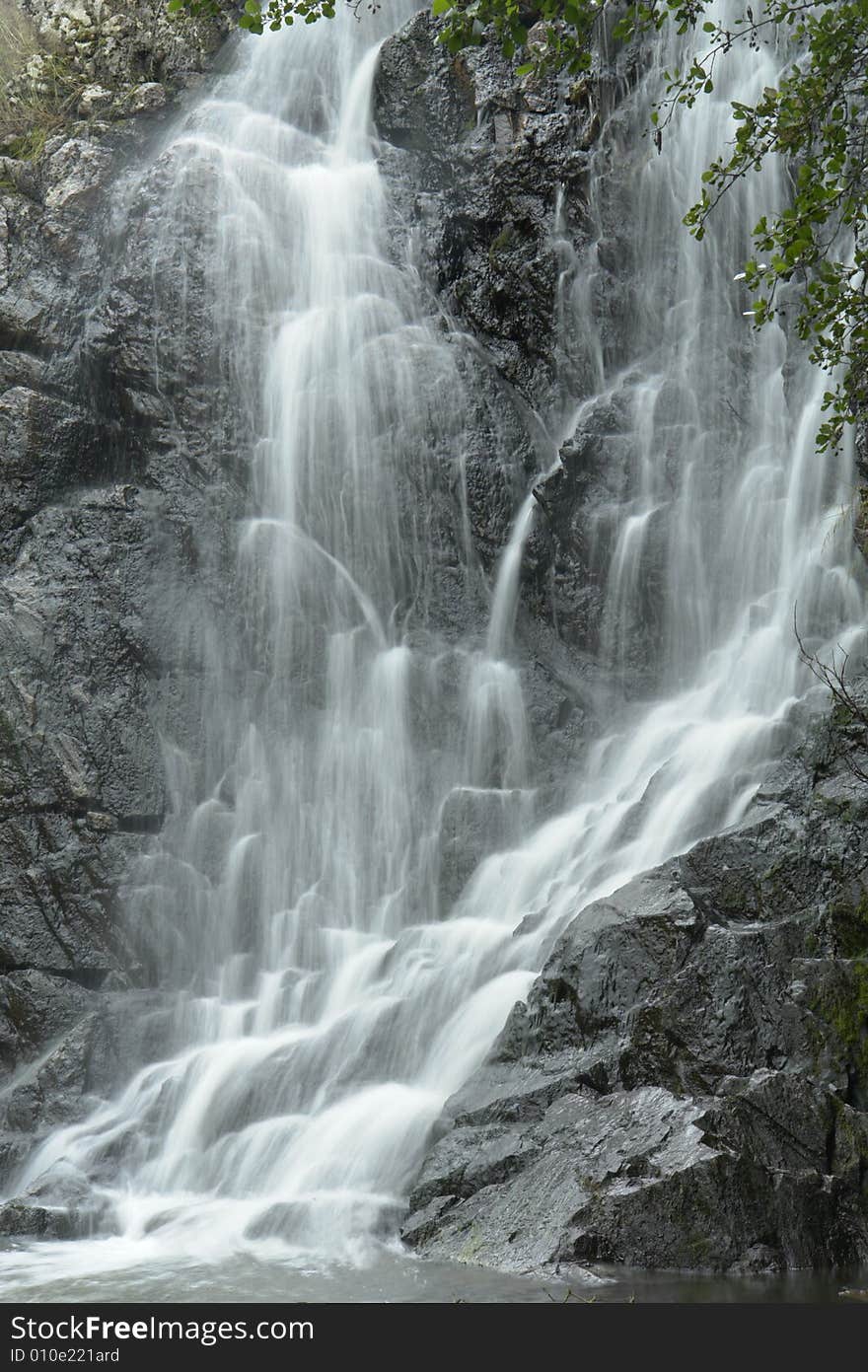 Water on a background of rocks. Water on a background of rocks