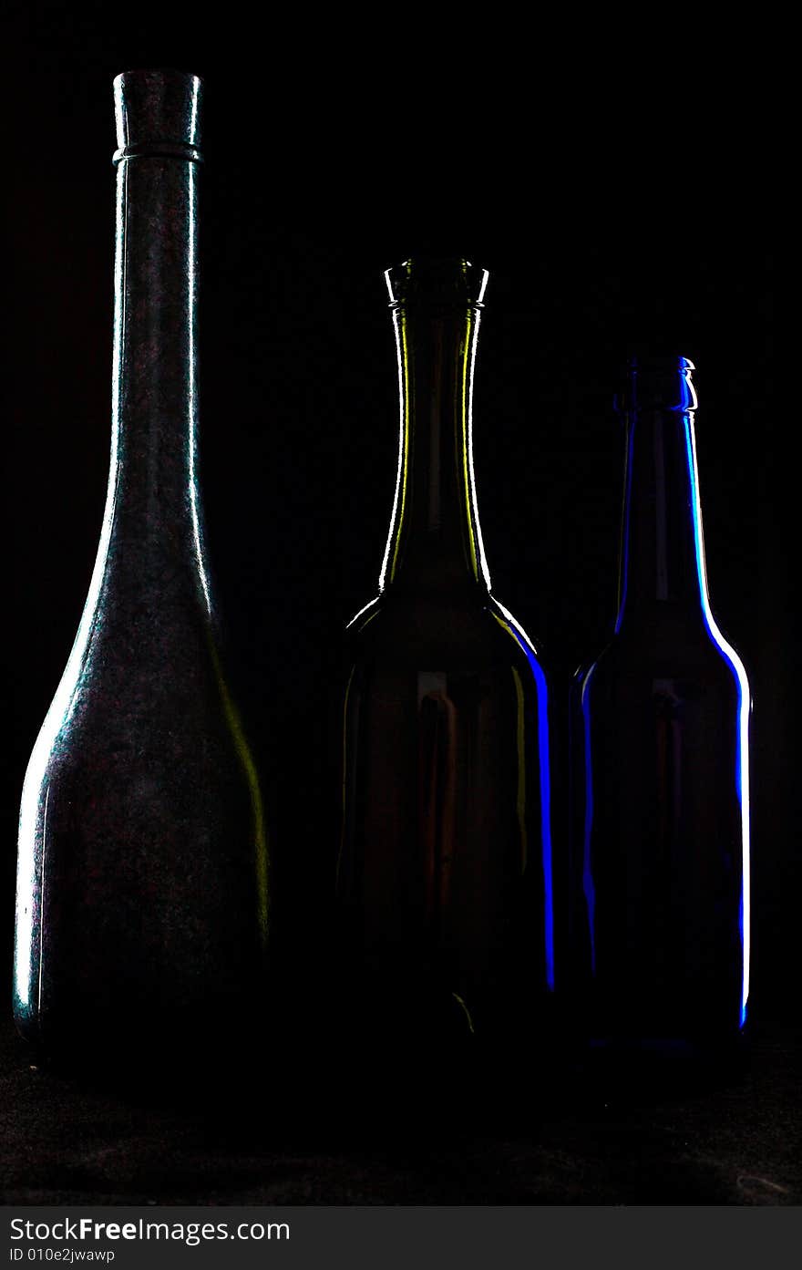 An image of three silhouettes of bottles