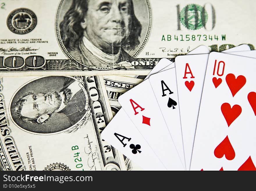 Four aces and red ten on dollars banknotes. Four aces and red ten on dollars banknotes