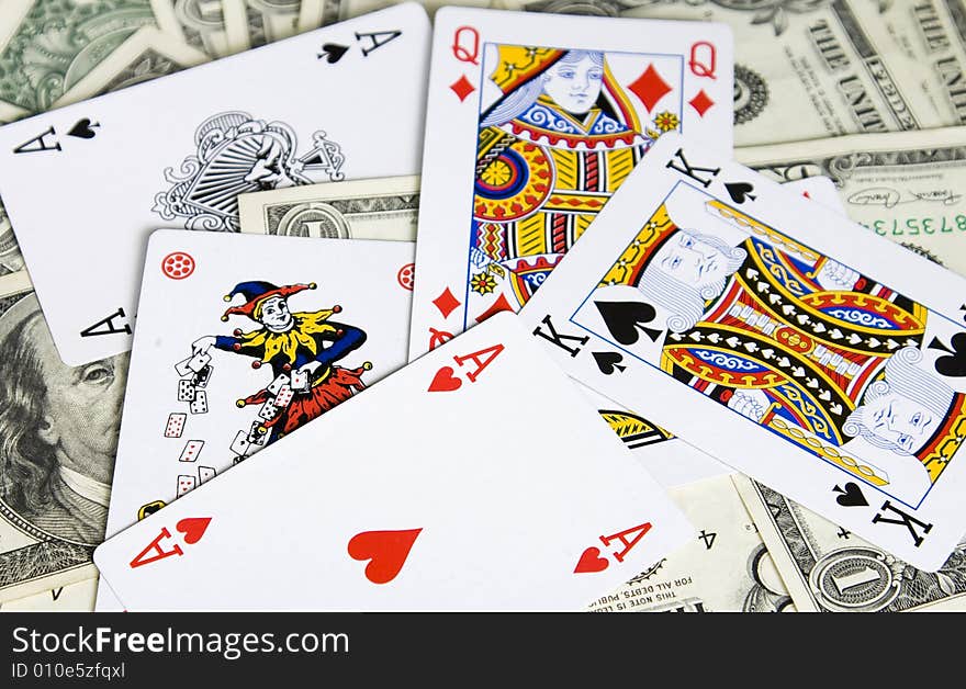 Poker cards on dollar banknotes. Poker cards on dollar banknotes