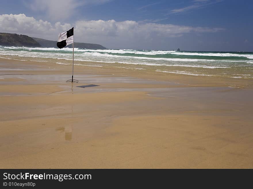 A cornish beach deserted due to high winds