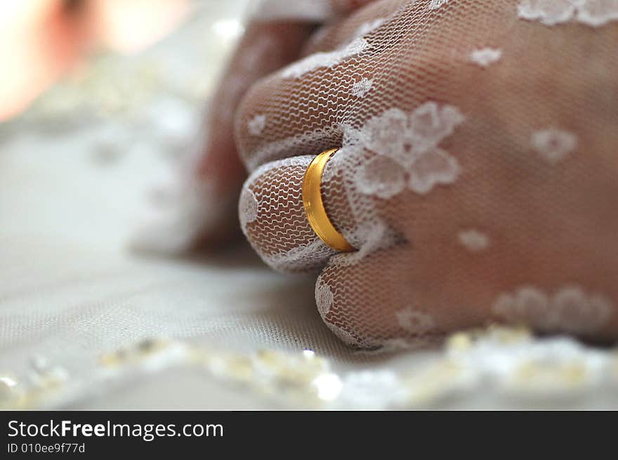 A bride wearing her wedding ring on her wedding day. A bride wearing her wedding ring on her wedding day