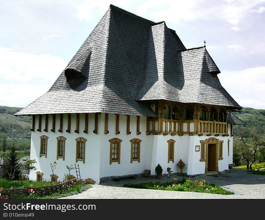 Barsana Monastery is a complex with sixteen nuns. Created after 1989, on the site of a church abandoned in 1790, the complex has become a significant cultural and religious attraction. Its 56 meter-tall church is the tallest wooden structure in Europe. The expressive detail carved into architectural forms by Maramures crafstmen is a reason to visit and stay at Barsana. No power tools or nails were used in the large wooden structures. Its north-Transylvania location puts it close to the Ukrainian border in a hilly forested landscape. Barsana Monastery is a complex with sixteen nuns. Created after 1989, on the site of a church abandoned in 1790, the complex has become a significant cultural and religious attraction. Its 56 meter-tall church is the tallest wooden structure in Europe. The expressive detail carved into architectural forms by Maramures crafstmen is a reason to visit and stay at Barsana. No power tools or nails were used in the large wooden structures. Its north-Transylvania location puts it close to the Ukrainian border in a hilly forested landscape.