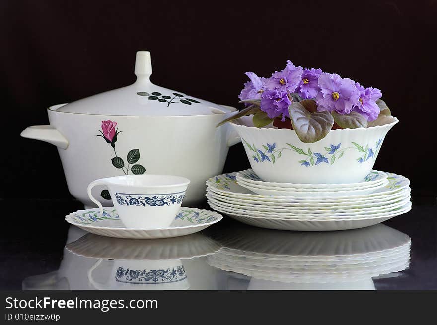 Collection of clean dishes against the black background. Collection of clean dishes against the black background