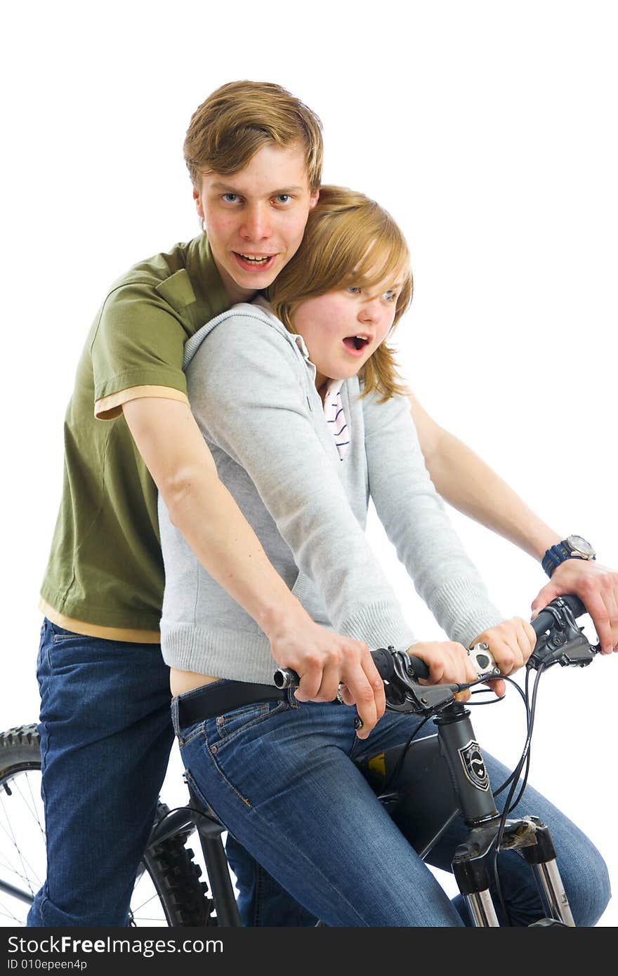 Young couple on a bicycle isolated on a white background