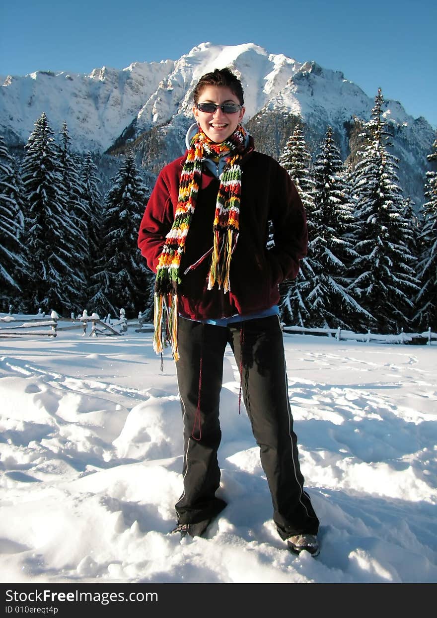 Young girl in winter mountains (Bucegi - Romania)